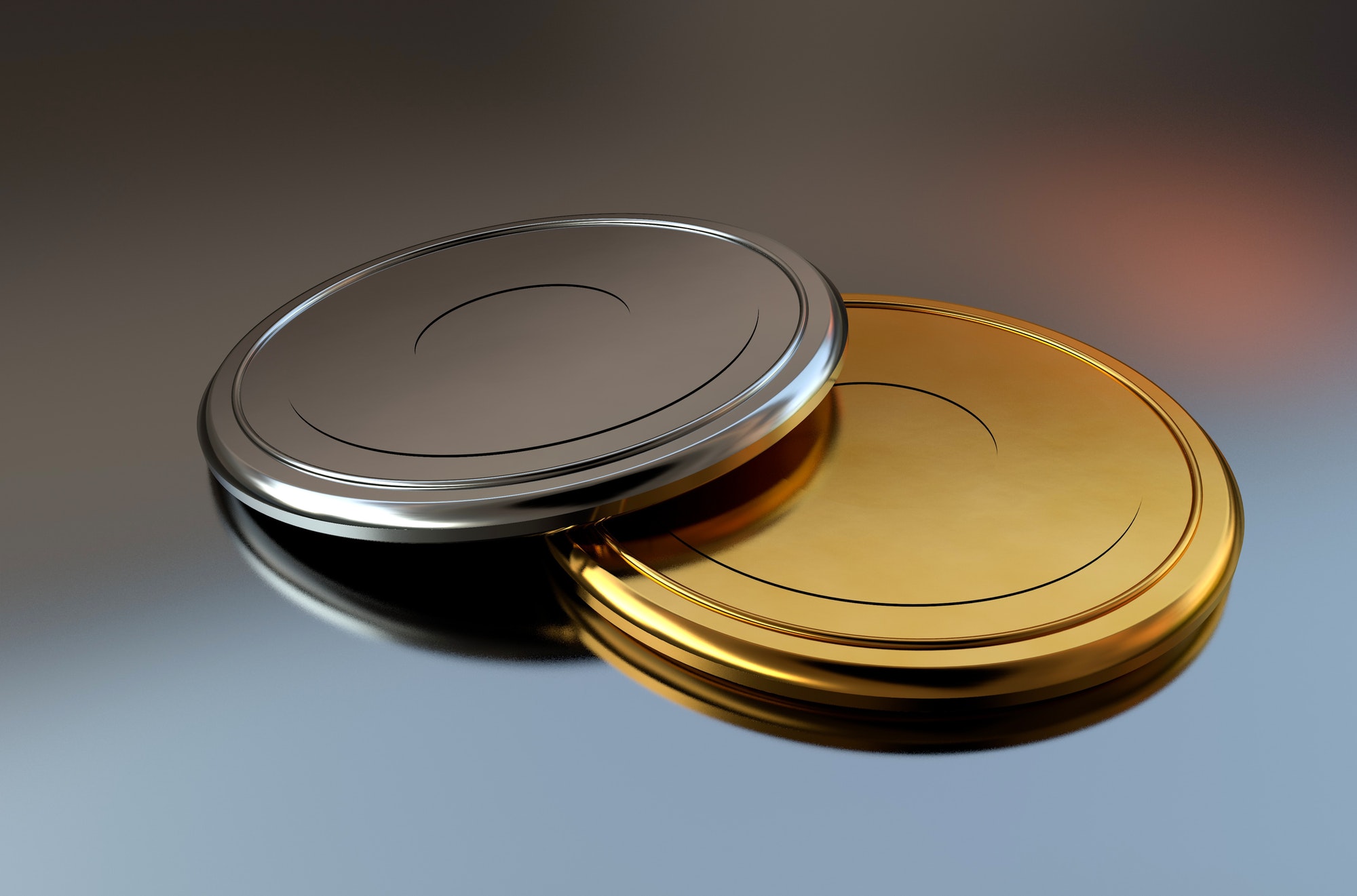 3D gold and silver medals or discs lying together on a mirror surface
