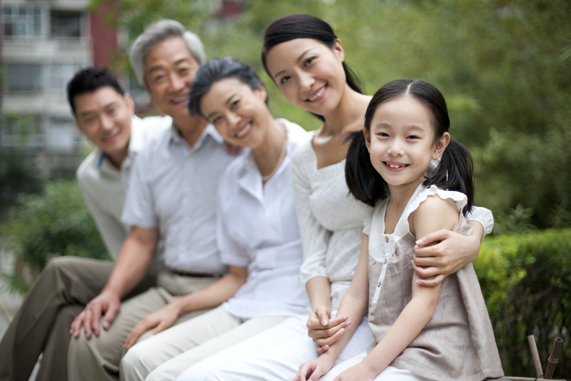 Chinese family with grandparents in a park